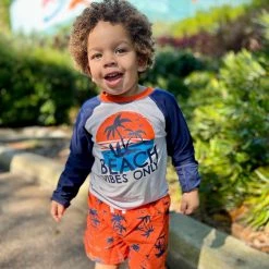 Gerber® See What's New 2-Piece Baby & Toddler Boys Vacation Vibes Rash Guard & Swim Trunks Set
